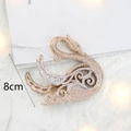 Ornamento natalizio a forma di cigno dorato glitterato con cordino e misura 8cm - Cigno