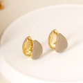 Detailed view of gold-plated teardrop enamel earrings on a white ceramic tray - Ear Buckle / 18K Gold Light Coffee