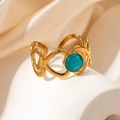 Detailed close-up of a gold heart-shaped ring band with a polished green opal gemstone - Blue Stone Heart Open Ring