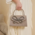 Elegante goldene Abendtasche mit Strass-Schleife und funkelndem Pailletten-Finish für Damen - Champagner