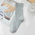 Pale blue minimalist cotton crew sock in a soft Morandi tone on white background - Blue