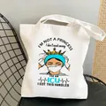 Nurse canvas tote bag in white featuring a themed print of a queen medical worker - Style C15 (No Inner Pocket/No Zipper)