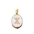 Macro shot of oval gold pendant with letter X inlay on white shell texture surface - Gold Letter X
