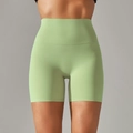 Close-up of light green high-waisted yoga shorts with seamless stitching and soft texture - Dark Green