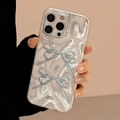Detail of iPhone case featuring blue bows and pearlescent texture with silk finish - Silver Two Blue Stacked Bows / iPhone 17 Air