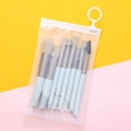 Portable 8-piece light blue makeup brush set with brown bristles in a clear zipper bag - Lake Blue + PVC Bag
