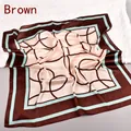 Elegant silk scarf featuring brown and mint geometric patterns on a soft satin fabric - Brown