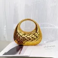Chic gold metallic clutch bag with rhombus relief pattern and integrated round handle - Gold