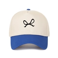 Detail of blue visor and cream five-panel trucker hat with black bow embroidery - Adjustable / Sapphire Blue