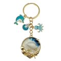 Goldener Ozean Schlüsselanhänger mit blauem Delphin Perle Muschel und Seestern Anhänger - Blau Oktopus Muschel