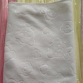 White microfiber bath towel with embossed cartoon bear patterns and high absorbency - White