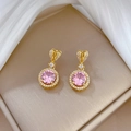 Close-up of pink round gemstone earrings with gold finish and white zircon accents - Pink Round Zirconia Stud Earrings (D332)