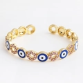 Golden open bangle with blue evil eye enamel and pink zircon-encrusted rings - Round Blue