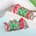 Close-up of two handmade candy-shaped glass beads with red and green hand-painted details - Price per Piece / Watermelon Red and Green