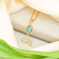 Detailed macro of gold tulip necklace with blue teardrop gemstone and white zircons - Sea Blue Tulip / Gold