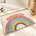 Rainbow pattern plush bathroom mat with absorbent fabric and non-slip backing - Over The Rainbow