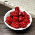 Close-up of red lion-head shaped vegetable ivory beads in a white bowl for DIY jewelry - 13mm (Single) / China Red