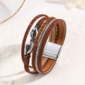 Detail view of multilayer brown leather bracelet with rhinestones and magnetic buckle - Coffee