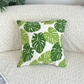Detail of green monstera leaf pattern on linen pillowcase against a white boucle sofa - Green Leaves (Insert Not Included)