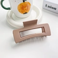 Matte milk tea brown rectangular hollow hair claw clip in a minimalist setting - 10.5cm / Khaki
