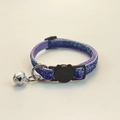 Detailed view of purple glitter cat collar with black cat-shaped buckle and silver bell - Metallic Purple