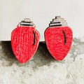 Detailed view of red Christmas light bulb wooden stud earrings on gray stone background - Red Christmas Light