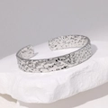 Irregular textured silver stainless steel open bangle with hammered lava finish - Steel