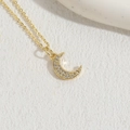Luxurious gold crescent moon pendant necklace paved with sparkling white zircon stones - Gold Zirconia Moon