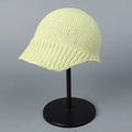 Close-up of pistachio green knitted bucket hat showing fine texture and rolled brim - M / Green