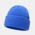 Close-up of bright blue ribbed knit beanie featuring thick vertical texture and wide fold cuff - One Size / Klein Blue