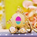 Sparkling golden pumpkin carriage keychain with colorful rhinestones and white accents - Jelly Pumpkin Carriage White