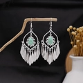 Ethnic bohemian silver tassel earrings with turquoise stones hanging on a wooden branch - Tear-drop Artificial Turquoise Tassel Style (E2165-1)