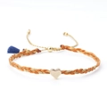 Orange and gold woven friendship bracelet featuring a gold heart charm and blue tassel - Orange and Gold (with Dark Blue Tassel)