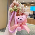 Pink resin yarn bear keychain with matching woven wrist strap and golden bell pendant - Sitting Knit Resin Bear-Pink