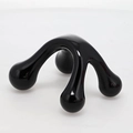 Manual mini handheld massager with 4 pressure points in polished black resin finish - Black
