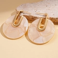 Close-up of 18K gold plated round earrings with beige marble texture acetate pendant - White Marble (Gold Plated)