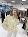 Relaxed fit cream yellow knit sweater with blue floral pattern and round neck design - S / Light Yellow