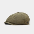 Detail of army green newsboy cap featuring cotton twill texture and metal side badge - Army Green