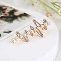 Close-up of golden metal hair clip with triangular rhinestones and pearls on a white stand - Rhinestone Pearl Row (S223-4)