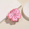 Pink acetate flower hair claw with rhinestone detail on a minimalist cream background - Pink