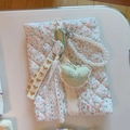 Detail of floral quilted cosmetic bag with pearl chain handle and lace embroidery - White Pink Green Floral