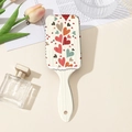 Détail d'une brosse à cheveux massante blanche à motifs de cœurs avec des fleurs décoratives - Style A Floral Rétro