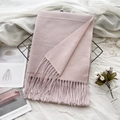 Light pink cashmere-feel scarf with tassels folded on a black metal display rack - 37# Lilac