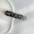 Detail of marble pattern hair clip with gold beads on white ceramic plate - Rock Black