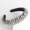 Baroque style padded headband featuring sparkling rhinestones on black velvet base - White