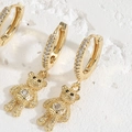Detail of golden huggie hoop earrings with textured teddy bear charms and clear zircon - Pentagram Zirconia Bear (ES2289)