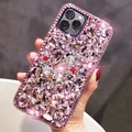 Handheld view of a pink luxury iPhone case with full rhinestones and a jeweled heart - Pink / 7P/8P