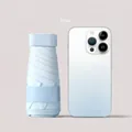Mini sky blue gradient flat folding umbrella next to a smartphone for size reference - Gradient Blue