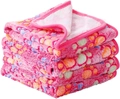 Close-up of soft pink flannel pet blanket featuring colorful paw prints and neat edging - Pink Paw Print