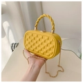 Detail of yellow checkered crossbody bag with twisted handle and gold chain strap - Yellow